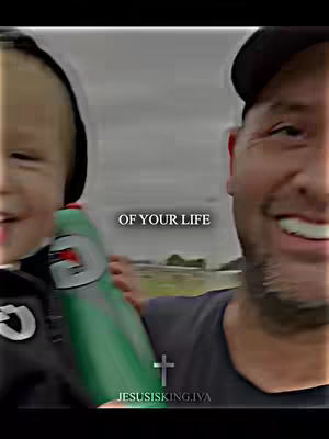 The image shows a man and a young child, seemingly outdoors. The man is on the right side, smiling. The child on the left side is holding a green Gatorade bottle. Overlayed text reads "OF YOUR LIFE", with a cross symbol below and the text "JESUSISKING.IVA". The overall composition suggests a moment of faith and positivity.