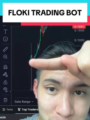 A man is pointing at a crypto trading chart on a screen, with text overlays at the top. The chart displays fluctuating green and red lines, indicative of price movements. The man's face is in focus, with a close-up shot emphasizing his expression and the chart behind him.