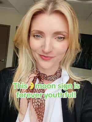 A woman with blonde hair and a scarf poses for the camera. Text overlayed on image in bright green.
