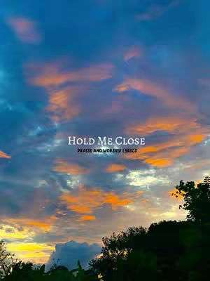 An image of a colorful sunset sky with clouds. In the foreground, there is a silhouette of trees. In the center, the text overlay reads 'HOLD ME CLOSE', with 'PRAISE AND WORSHIP LYRICS' below it. The sky transitions from blue to orange and pink.