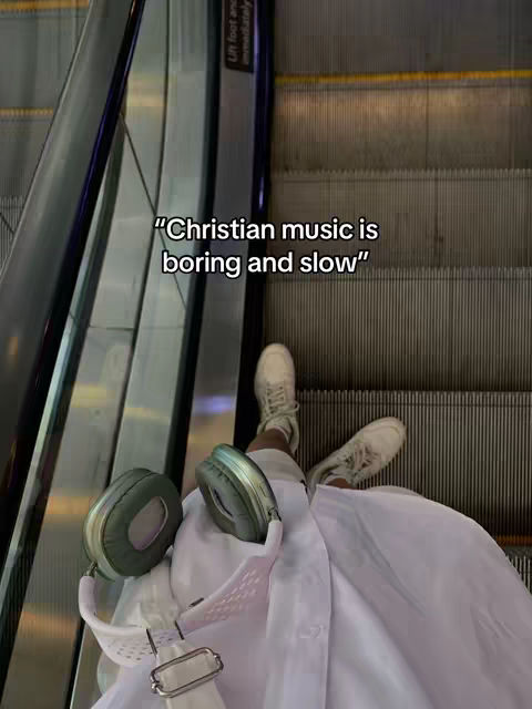 The cover image shows a person's legs and feet on an escalator, with Christian music is boring and slow written on top of the escalator.