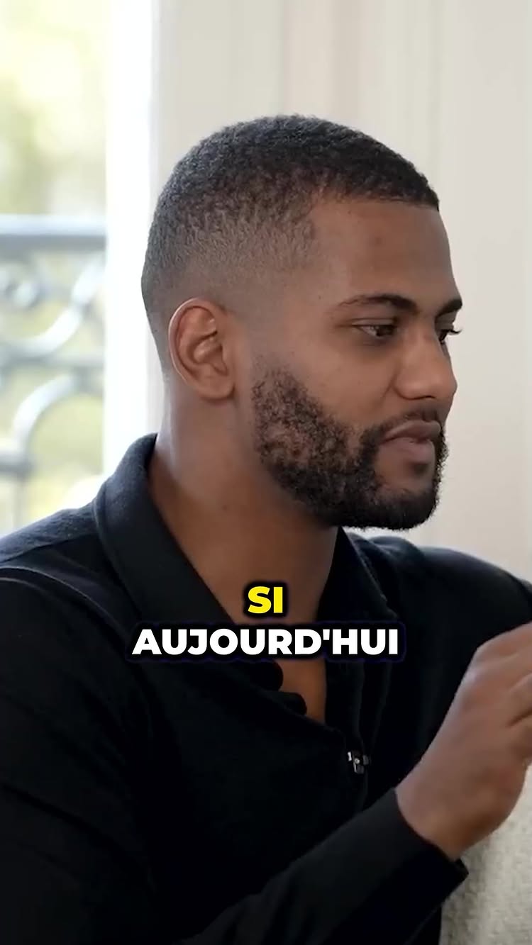 A man in a black shirt is the central figure, slightly angled to the right, with a short haircut and a neatly trimmed beard. A yellow text overlay reads 'SI AUJOURD'HUI', positioned at the bottom.