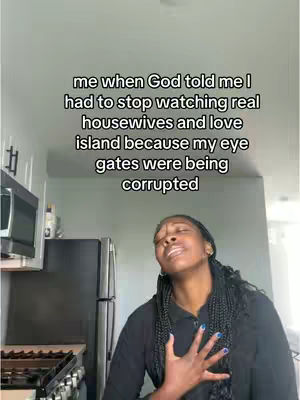 A woman with long, braided hair stands in a kitchen, her eyes closed and hand on her chest. Text overlays the image.