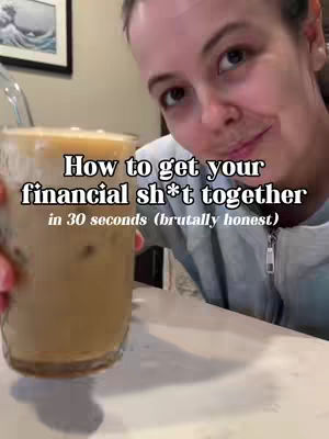 A selfie-style video cover image shows a woman holding a glass of iced coffee, with text overlayed on the image. The woman is smiling and looking at the camera. The background is a bit blurry, with a wall and what looks like a framed piece of art.