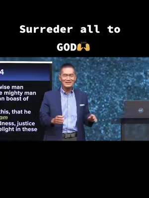 The image features a man in a blue blazer and striped shirt standing in front of a screen. Text overlays at the top provide a message of faith. The composition includes a stage-like setting with a blue background.