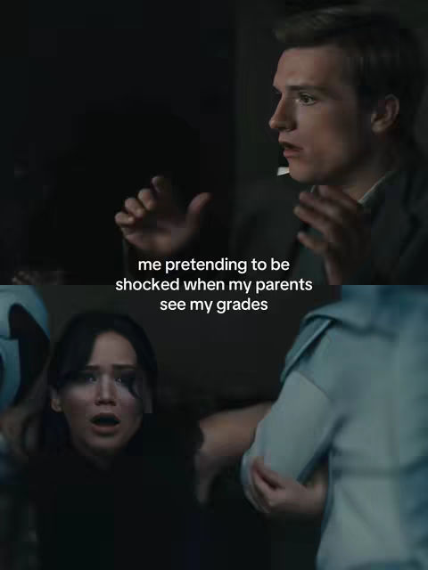 The cover image is a slightly desaturated still from a movie, featuring two main figures: a young man on the right side of the frame, looking to his left with a concerned expression, and a young woman on the bottom left, also looking shocked and with her mouth open. Text overlayed on the image reads: "me pretending to be shocked when my parents see my grades". The composition is dark, with the focus on the actors' facial expressions conveying a sense of drama.