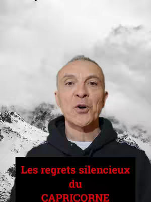 The image shows an older man with graying hair, looking directly at the camera with an open mouth. Behind him is a background depicting a snowy mountain range with cloudy sky. A black banner with red and white text overlayed on the image.