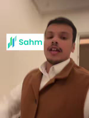 A man stands in a room, facing the camera. A white rectangle with the word 'Sahm' and a logo is on the left.
