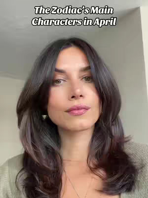 A woman with long dark hair and light makeup faces the camera, with text overlayed at the top of the image.