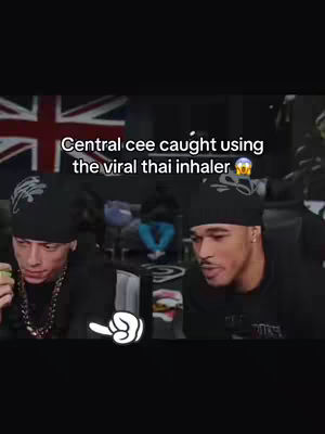 The cover features two men, possibly celebrities, in a video screen capture. The man on the left is holding a green item. The man on the right is looking towards the camera. The superimposed text reads, 'Central cee caught using the viral thai inhaler.' A British flag is in the background.