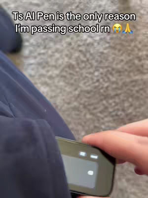 A person's hand holding a digital pen device, seemingly in a pocket. The background is a blurry, neutral color, and the cover image contains text overlaying the scene.
