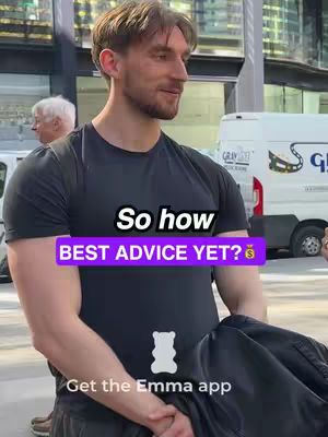 A man in a black t-shirt stands on a city street with a cityscape and a van visible in the background. Overlaid text includes a question and a call to get the Emma app.