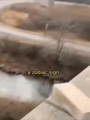 The cover image shows an outdoor scene with a blurred background and a text overlay that says 'a zodiac sign'. The foreground contains a white structure.