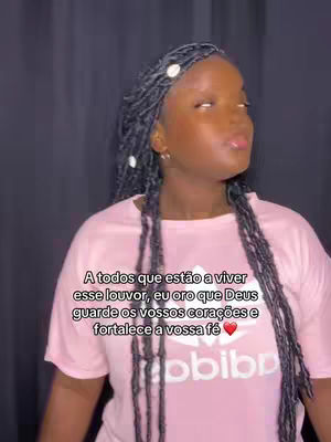 A young woman with dark braided hair is the focus of the image. She's wearing a pink t-shirt featuring the Adidas logo. Text is overlaid on the image, and the background is a blurred, dark color.