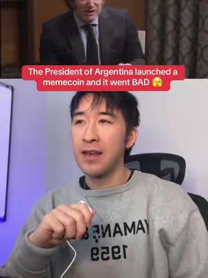 The cover image presents a split-screen setup. The top section features a medium shot of a man in a suit, speaking, against a neutral background. Overlaying a bright red bar with white text indicating the president of Argentina launched a memecoin. The bottom section shows a younger man in a gray sweatshirt, holding a microphone, with a serious expression. His sweatshirt includes inverted colored prints.