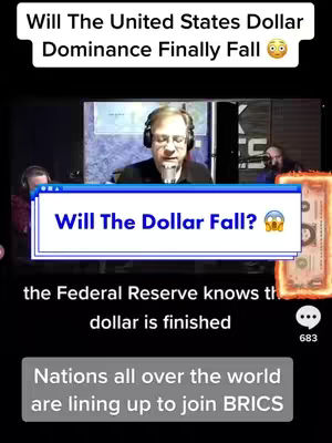 The cover image is a screenshot of a video featuring a man speaking into a microphone, likely in a studio setting. Text overlays are present, including a headline at the top stating, 'Will The United States Dollar Dominance Finally Fall.' A lower text overlay asks, 'Will The Dollar Fall?' The background appears to be a screen displaying either a news broadcast or an interview setting. The overall composition is designed to attract attention with its bold text and the serious expression of the man.