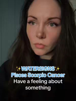 A woman with long dark hair and a serious expression is the central figure, set against a blurred, dark background. Overlayed text in white and blue announces "WATERSIGNS" and lists "Pisces Scorpio Cancer," suggesting an astrology-related theme.