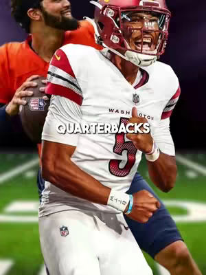 The image shows a football player in focus, wearing a white jersey with the number "5." The player is mid-action, with his mouth open and a gesture with his thumb up, indicating a pose of enthusiasm or approval. Behind him, another player is visible in a different uniform. The text "QUARTERBACKS" is overlaid on the image in a bold, sans-serif font. The color scheme is dominated by white, burgundy, dark blue, and a green background suggesting a sports field.