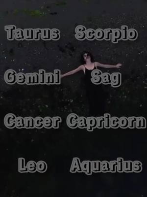 An overhead shot featuring a woman in a black outfit floating horizontally in dark water, with several zodiac signs superimposed in white outlined text around her.