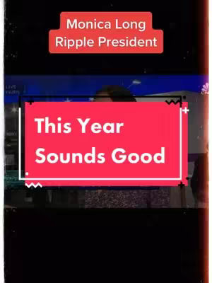 A vertically oriented cover image features a news broadcast backdrop with a person speaking. Two prominent red rectangles overlay the visual, containing text in white. The top rectangle reads "Monica Long Ripple President", while the larger bottom block states "This Year Sounds Good". Overall, the image has a modern, digital aesthetic, appearing on a black background.