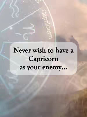 An image with a dreamy, blurred background featuring a portion of a zodiac wheel that says 'Capricorn' in white, and an overlaid text box. The box has black text stating 'Never wish to have a Capricorn as your enemy...'