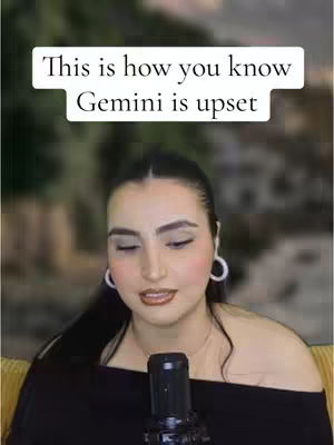 The cover image shows a woman with dark hair and makeup looking down, as if concentrating, with the top half of her body and a microphone featured. Above her head is text on a white background. The background is blurred and green.