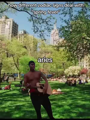 The image shows a man playing the guitar in a park on a sunny day, with a city skyline in the background. Text overlays indicate the video's theme - astrology and how different zodiac signs deal with 'spring fever'.