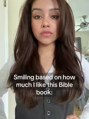 The image features a woman with long brown hair, wearing a dark vest over a white shirt. Text overlays are present, and she appears to be smiling.