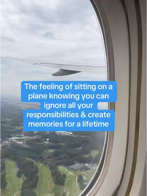 An image taken from inside a plane, looking out the window. The window frame is on the right side of the image. Outside the window, the wing of the plane is prominently displayed, along with a cloudy sky. Below, the landscape is visible, with green fields and some buildings. Text overlays in blue boxes cover part of the scene, giving the video a message related to travel and escaping responsibilities.