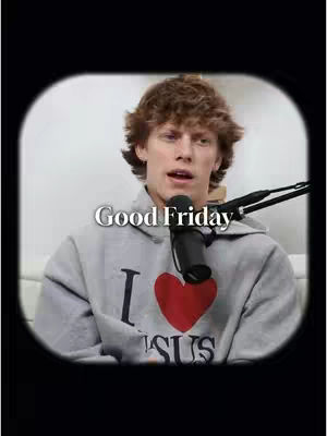 The cover image is a selfie-style shot of a young man with light brown, curly hair. He is speaking and has a microphone in front of him on a stand to the right. He is wearing a gray hoodie with a large red heart and the words "I ? JESUS" printed on it. The background is blurred, with a white surface and soft lighting. The text overlay "Good Friday" appears at the top of the image.
