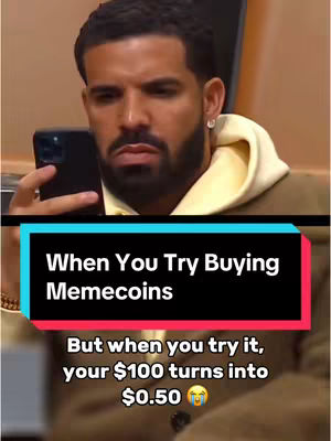 The cover image is a split-screen. The top half features a man (Drake) looking at his phone with a concerned expression. The bottom half has a text overlay against a teal and red stripe. The background is a beige room. The man is wearing a yellow hoodie, and holding his phone. The bottom half of the image has the following text: 'When You Try Buying Memecoins, But when you try it, your $100 turns into $0.50'.