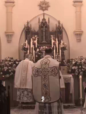 The cover image shows a church interior with two figures in religious vestments. They are at the altar, with candles lit around. A cross and the church altar can be seen.