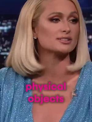 The cover image features a portrait of Paris Hilton, with her blonde hair and dressed in a blue sequined top. Overlayed on the image, text in a pink font reads "physical objects". The background is blurred, suggesting a studio or interview setting.