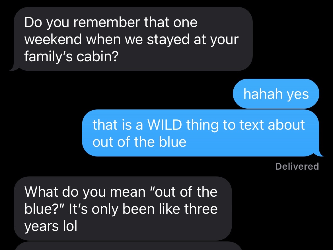 A screenshot of a text message conversation, with speech bubbles in black and blue on a black background. The blue bubble contains the text 'that is a WILD thing to text about out of the blue'.