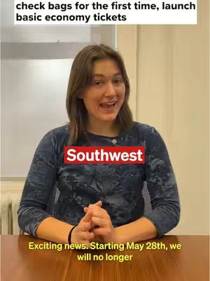 A woman with long brown hair is speaking to the camera. Above her is the text, ‘check bags for the first time, launch basic economy tickets.’ A red box that says “Southwest” is displayed, and below her, the text reads, “Exciting news. Starting May 28th, we will no longer”. The woman is smiling and seated at a brown wooden table.