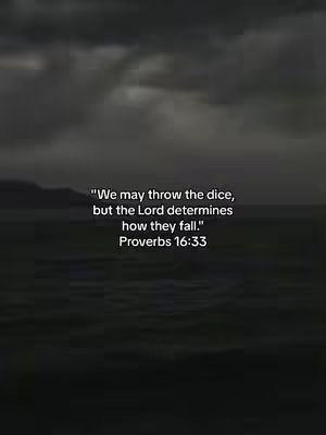 The image features a dark, cloudy sky with a blurred landscape at the bottom. Centered on the image is white text with multiple lines, quoting Proverbs 16:33.