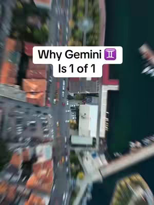 An aerial view of a city with buildings, streets, and a body of water. A white rectangle with text sits in the middle of the image.