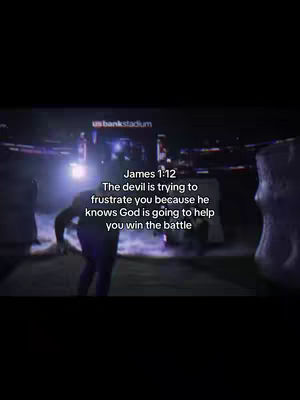 A nighttime shot inside a stadium shows a person in silhouette walking toward a bright light, with the text overlayed on the bottom. The background shows the stadium lights and signage.