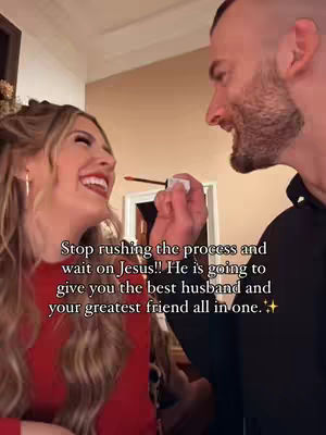 A couple is shown in a close-up, with the woman smiling while the man applies lipstick with a makeup brush. The text overlay, in vertical white letters, offers advice on waiting on Jesus and finding a good partner.