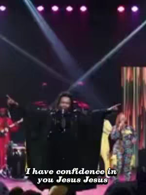 The cover image captures a live performance on stage, with a singer holding a microphone and gesturing with both arms. The stage is lit with colorful lighting, and other figures, presumably musicians and backup vocalists, are on the stage as well. The text overlay states, 'I have confidence in you Jesus Jesus' in a bold, white, sans-serif font.