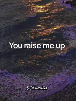 Abstract image of ocean waves during sunset with text overlay: 'You raise me up'. The water is a deep purple and dark blue with golden light reflecting on the surface. Text is white.