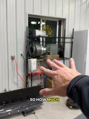 The image shows a hand reaching out towards the viewer, with a room behind it. The room has a window with some equipment visible such as a shelf and a fan. There is text that indicates the video is about how much Dogecoin the poster mines in a day. The angle of the shot is from the point of view of the person.