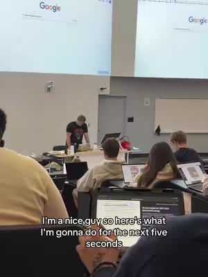 The cover image shows a classroom scene with students and a professor. There is a light-colored background and an overlay of text. The professor is standing up at the front, while students are sitting at their desks. There are computer screens in front of them. The text overlay reads, "I'm a nice guy so here's what I'm gonna do for the next five seconds."