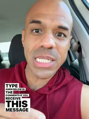 The cover image shows a close-up of a bald, dark-skinned man inside a car, looking directly at the camera. He is wearing a burgundy hoodie. Added, in white, is a framed text overlay that reads:  TYPE AMEN BELOW IN THE COMMENTS IF YOU RECEIVE THIS MESSAGE, composed of three lines with bold text.