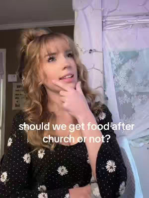 A young woman with light skin and blonde hair is looking towards the upper right area of the frame. She is wearing a black shirt with white floral patterns. The text overlay says, "should we get food after church or not?"
