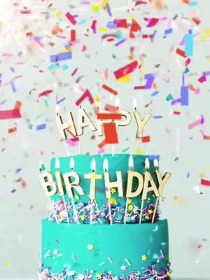 A vibrant image features a two-tiered teal birthday cake with the words 'HAPPY BIRTHDAY' written on it in gold lettering and candles. Above the cake, colorful confetti is scattered against a light background.