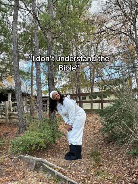 A woman wearing a white sweatsuit and large black fuzzy boots is bending forward, smiling, in an outdoor setting with trees and foliage. Text overlay is present.