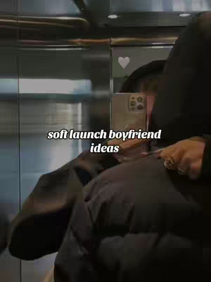 A selfie taken in an elevator, with the subject partially visible and holding a phone up to capture the shot, presenting a mirror reflection. The image features the text overlayed in a simple font.