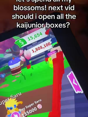 A screenshot of a Roblox game interface. Across the top, overlaid text asks if the viewer should open the boxes. The game screen shows an in-game store or inventory with numerical values for currency.