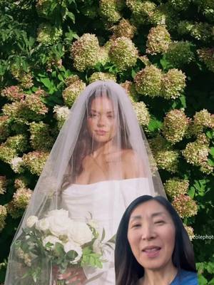The cover image shows a bride, veiled and holding a bouquet of white flowers, standing in front of a backdrop of green foliage and blooms. In the bottom right corner, there is a inset showing a woman’s face.